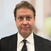 Will Bergstrom Profile Square Picture of a person in a cell awaiting extradition